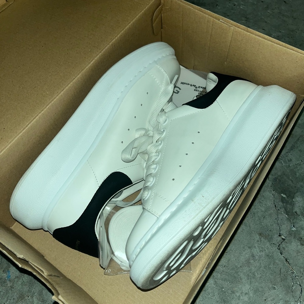 Worn a few times. A tiny scuff mark. paid $471 for them.